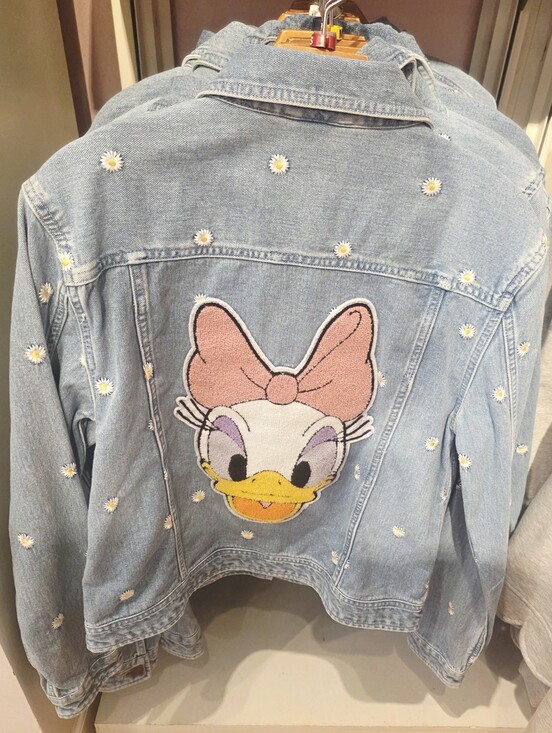 Disney Jackets & Blazers - Disney Denim Jacket features an embroidered Daisy Duck back patch with scattered